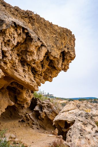 A vertical shot of a hiking trail between steep mountain walls in Avakas Gorge, Cyprus