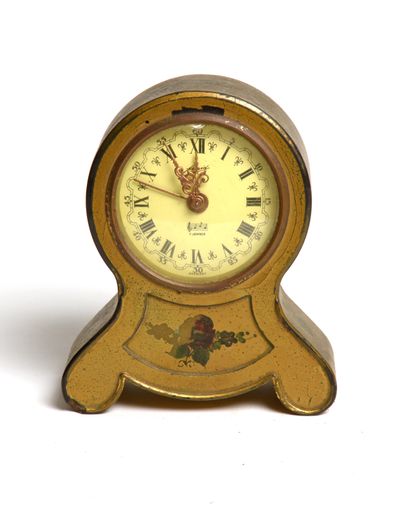 A broken vintage alarm clock isolated on a white background
