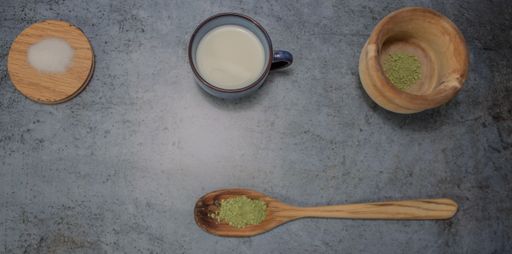 A closeup shot of ingredients for matcha tea preparation