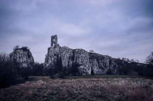 A view to the ruins of the castle on the rock in dramatic atmosphere near Klentnice, Czech republic