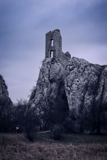 A view to the ruins of the castle on the rock in dramatic atmosphere near Klentnice, Czech republic