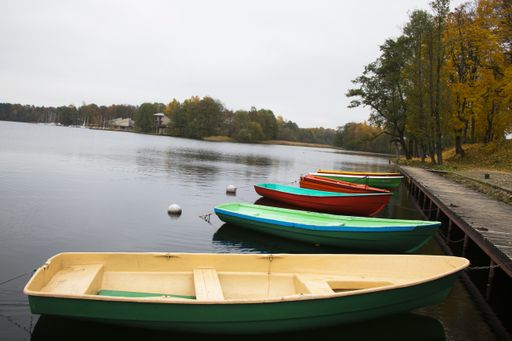 Old wooden boats near the beach of Trakai Gavle lake