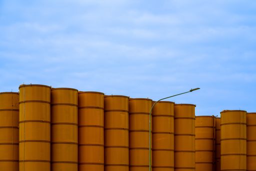 Yellow Construction Silos against blue sky. Horizontal shot