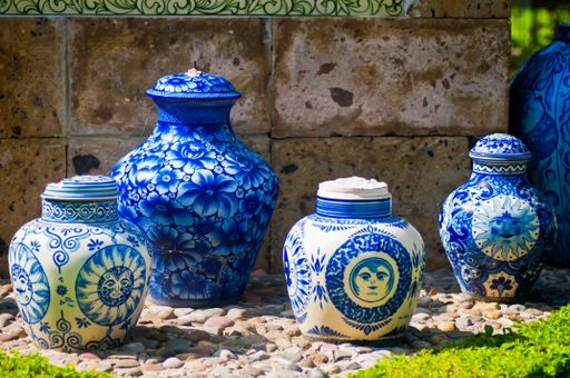 A closeup shot of beautiful vintage ceramic pots with blue patterns