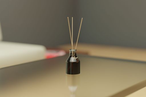 An image of a glass table with incense sticks on top