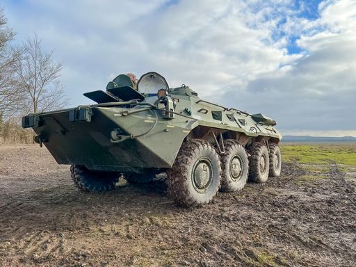 A high-resolution close-up of a Soviet Russian BTR-80 8x8 wheeled amphibious armoured personnel carrier is depicted in this image