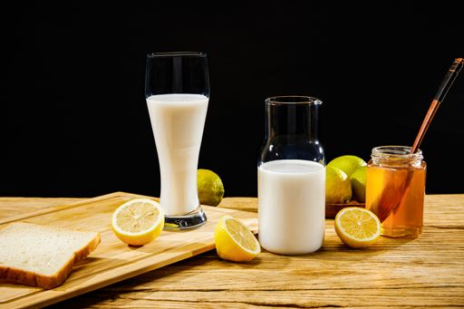 A closeup of natural rustic products on a wooden surface and black background
