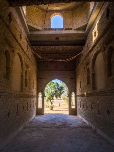 A vertical interior view of an old sand building in Morocco