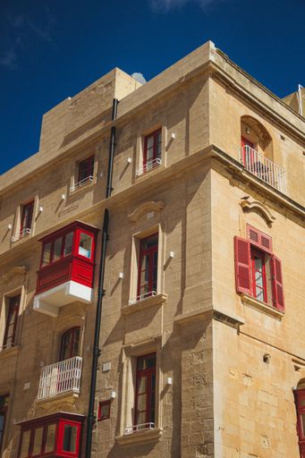 A low angle shot of the Bridge Bar in Valletta, Malta under a clear blue sky