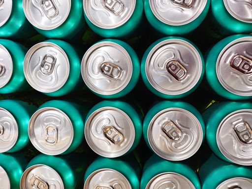 A top view of many green aluminum cans