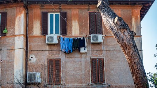 Rome 2021: Clothes, called panni, hung out to dry, in the typical buildings of the characteristic historic district of Garbatella. Rome, February 2021