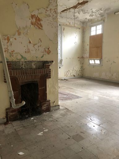 A vertical shot of an abandoned Amiantos hospital from inside in Cyprus