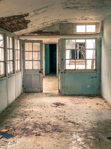 A vertical shot of an abandoned Amiantos hospital from inside in Cyprus