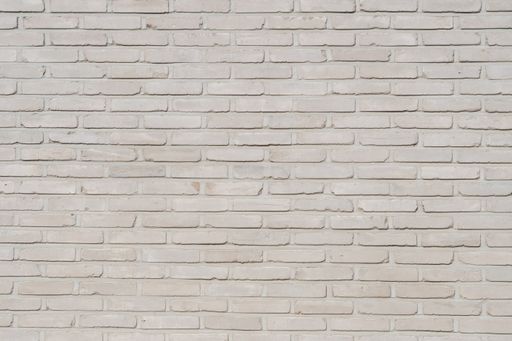 A texture of an old light gray brick wall texture