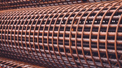 A closeup shot of the rebar for a reinforced hole in the ground