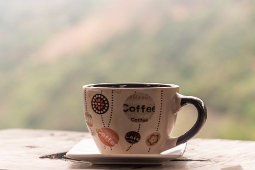 A closeup shot of a coffee cup on the table
