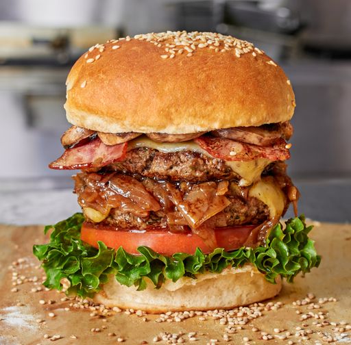 A closeup shot of a delicious hamburger on the table