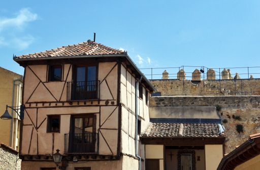 A beautiful shot of a short white building in Segovia, Spain