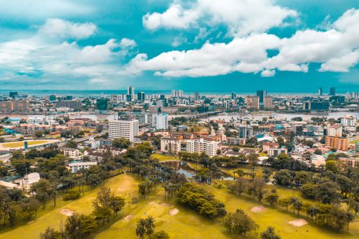 An aerial view of Lagos cityscape before the sea on a sunny day