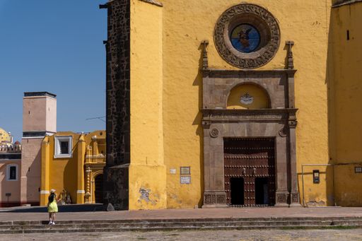 A daytime cloudscape behind historical San Gabriel Friary Catholic church in Cholula, Mexico