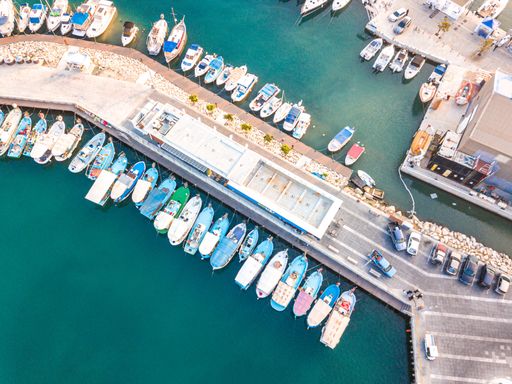 An aerial shot of boats moored at the stunning Limassol Marina, Cyprus, on a sunny day
