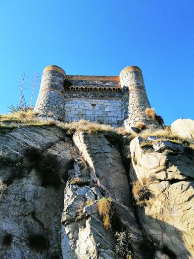 A bottom view shot of a castle on the hill in Toledo, Spain