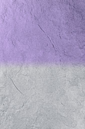 A vertical shot of purple and gray colors on a concrete surface