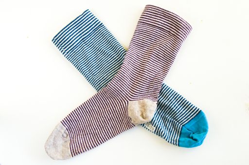 A top view of down syndrome symbol colorful socks with lines - down syndrome day