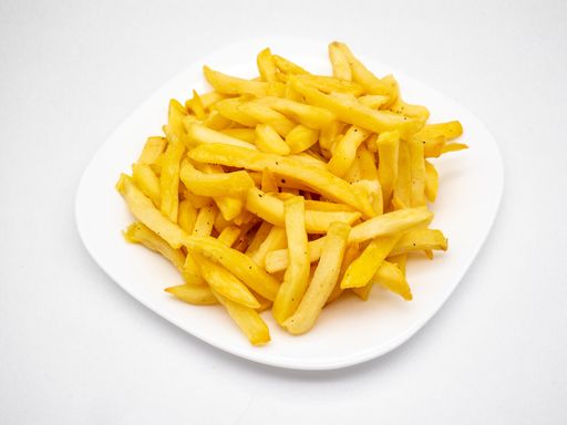 An appetizing french fries on a plate against a white background