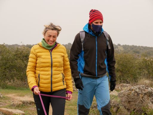 A couple of hikers walking on a cold day
