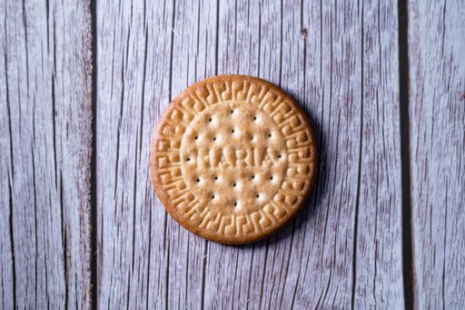 A top view of a fresh Maria cookie (galleta Maria) on a wooden sur