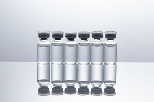 A closeup shot of covid19 vaccine bottles on a white background - covid19 concept