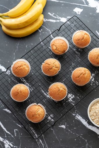 A vertical shot of healthy homemade muffins made with whole wheat flour, bananas, and oatmeal