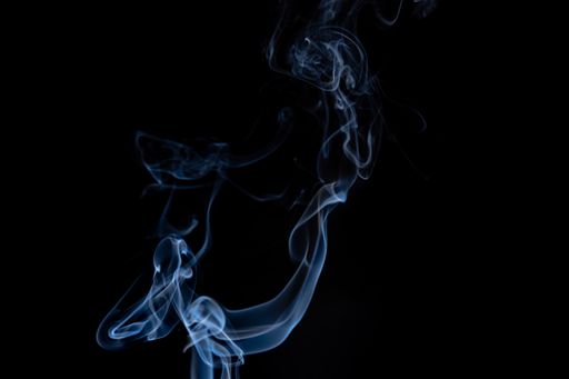 White smoke on black background