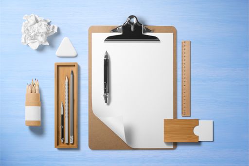 a top view of office and educational supplies on a blue background
