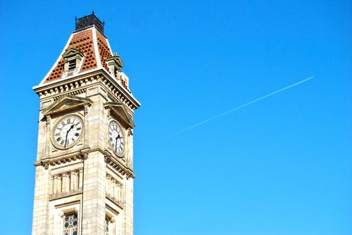A beautiful shot of a clock tower with amazing clear blue sky with space for text