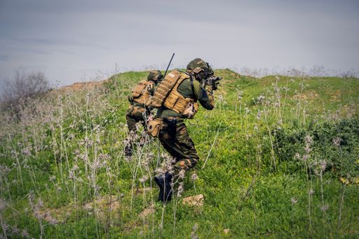 Fully equipped soldiers carrying out a military operation