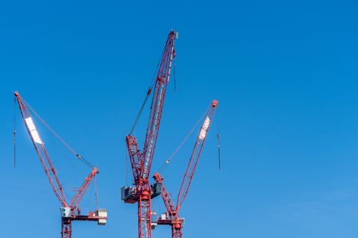 A low angle shot of a set of metal constructions under a clear blue sky