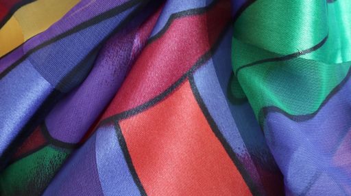 Photo silk fabric. Silk scarf with a light abstract print. Flower pattern with plums and cornflowers. Textile design 