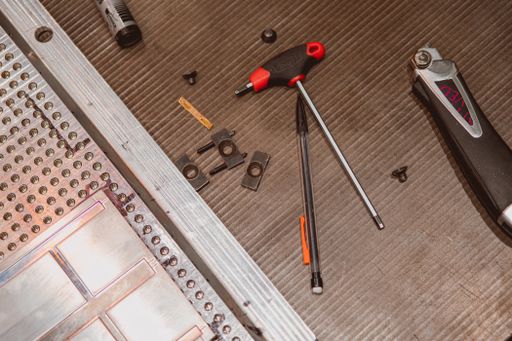 A closeup shot of various work tools for repairing on a working desk