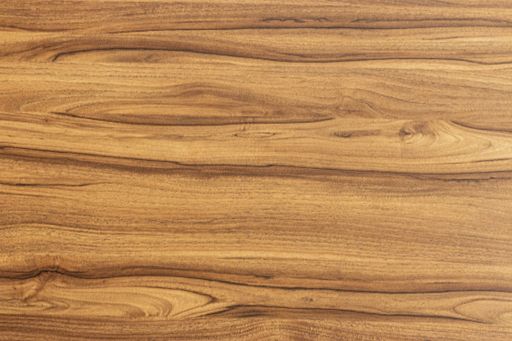 Natural varnished wood texture background. Top view of an walnut wood veneer Background of walnut wood. Top view of a wood sample surface.
