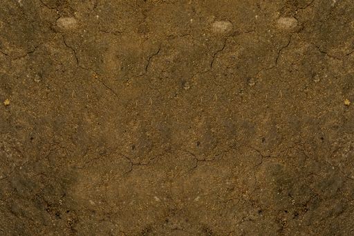 A brown sandy ground with cracked bits - cool nature background and texture