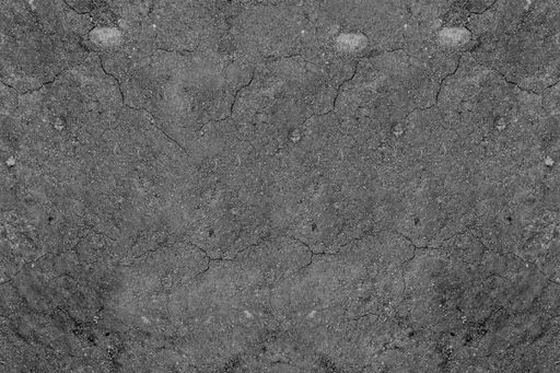 A closeup shot of a rough gray grain surface with cracks on it