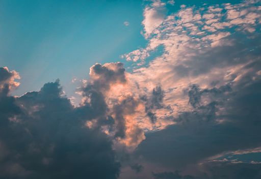 A mesmerizing cloudscape with fluffy clouds at sunset or sunrise
