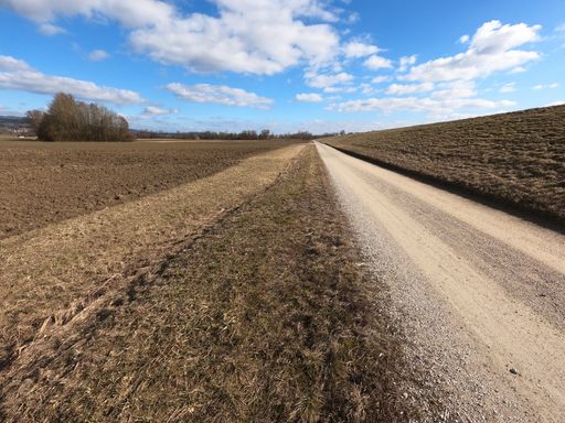 A natural view of an empty country road in Bavaria, Germany under  cloudy sky background