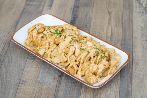 A delicious plate of french fries with sauce