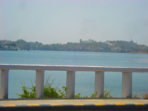The white balustrade against the background of the azure sea