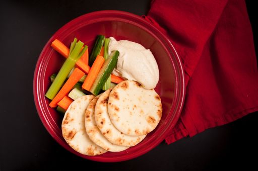 home made hummus or hummous with naan bread and vegetable sticks