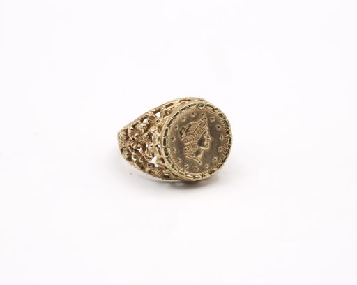 A golden coin textured ring isolated on a white background.