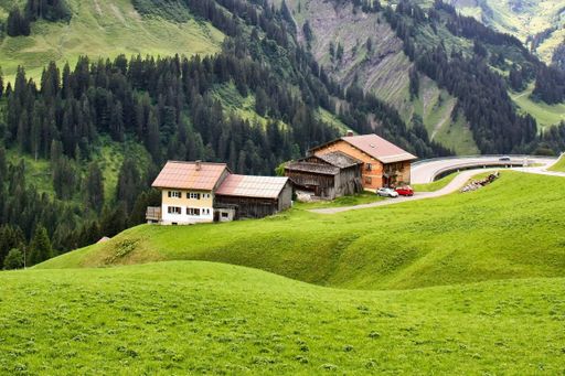 cultivated alps in a gently rolling landscape in the allgu alps, germany, green gently rolling landscape